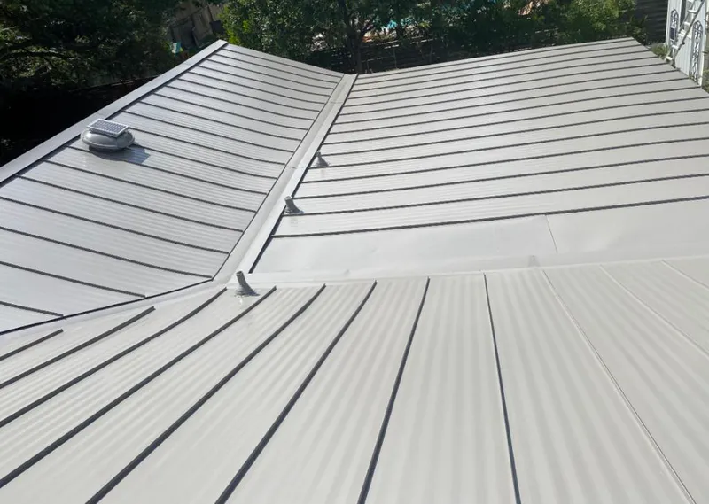 Solar attic fan installed on a metal roof for Roof Ventilation in Swoyersville